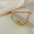 Pulseira feminina em aço de titânio dourado #32 da F&J Boutique em Maputo - imagem 2